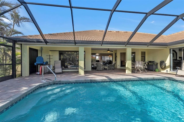 back of house with a lanai, a patio area, and ceiling fan