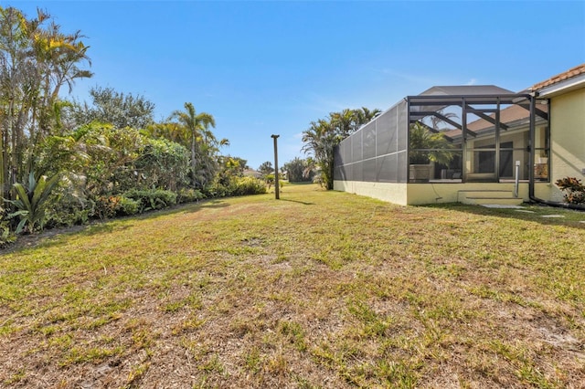 view of yard with a lanai