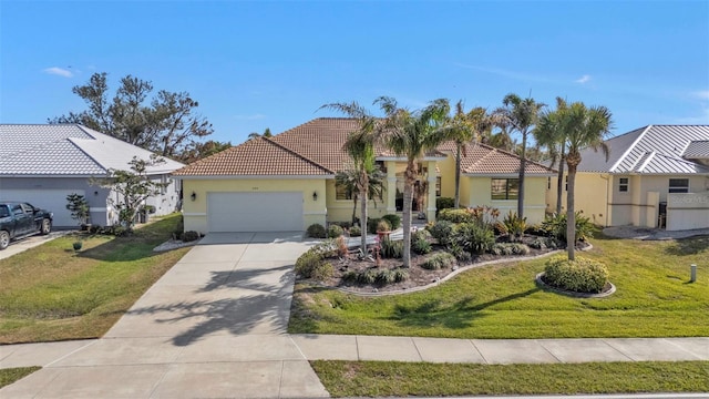 view of front facade featuring a front yard and a garage