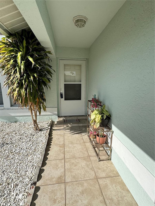 entrance to property featuring a patio