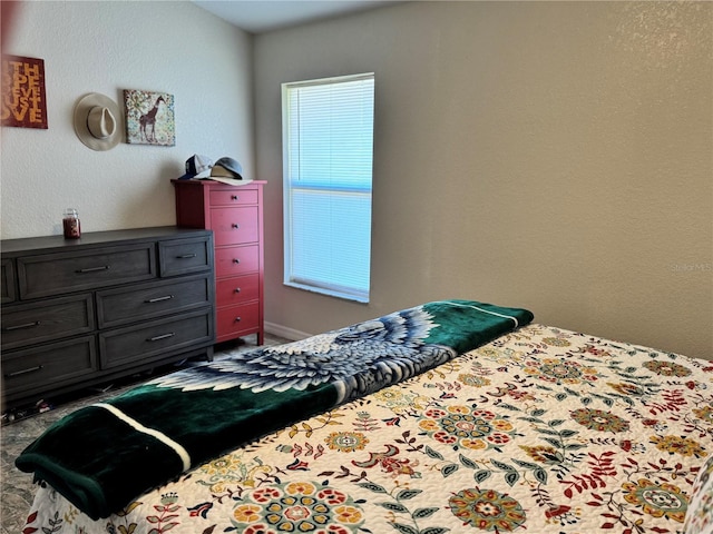 bedroom featuring multiple windows