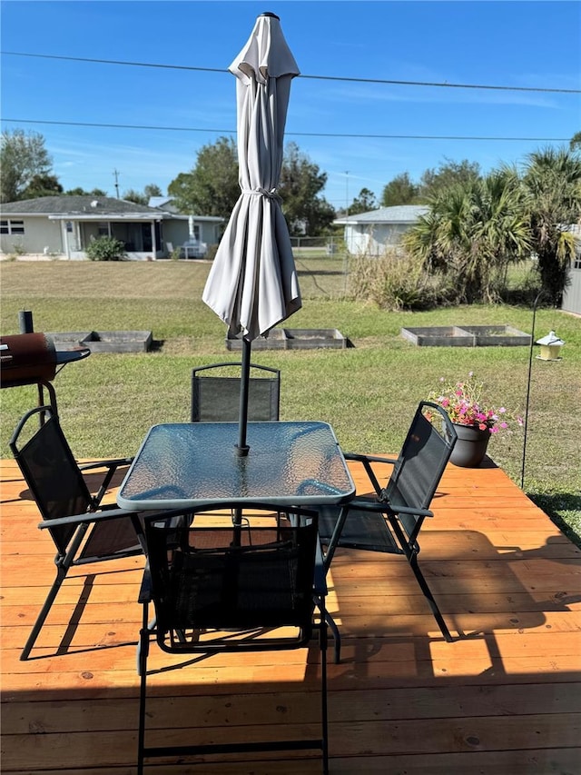 wooden deck with a yard