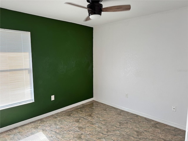 unfurnished room with ceiling fan