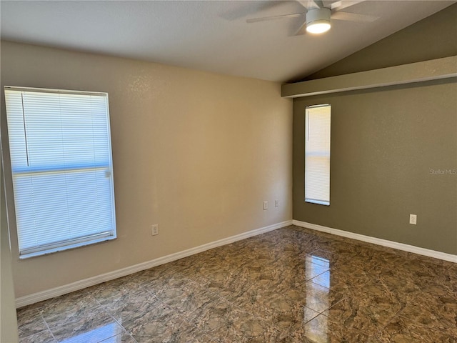 unfurnished room with ceiling fan, a healthy amount of sunlight, and lofted ceiling