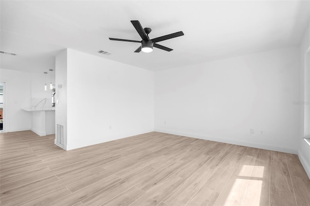 unfurnished room with light hardwood / wood-style floors and ceiling fan