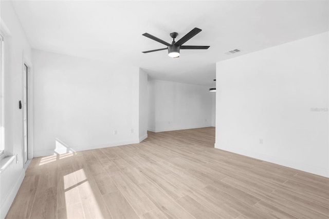 spare room featuring ceiling fan and light hardwood / wood-style flooring