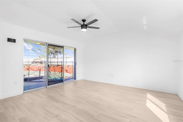 empty room featuring ceiling fan and light hardwood / wood-style floors