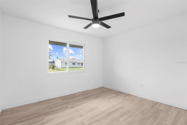 empty room featuring light hardwood / wood-style flooring and ceiling fan