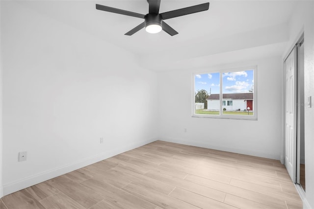 spare room featuring ceiling fan and light hardwood / wood-style flooring