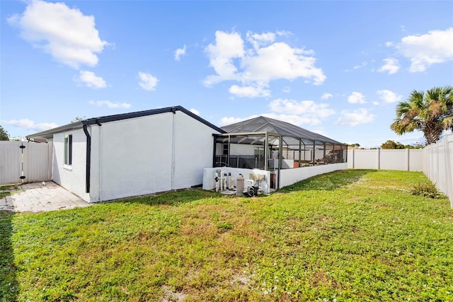 view of yard featuring glass enclosure