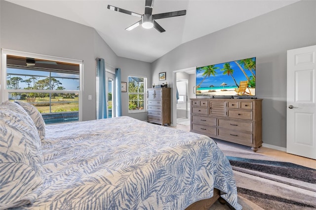 bedroom with ceiling fan, vaulted ceiling, access to outside, and connected bathroom