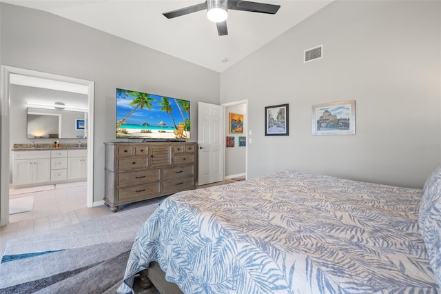 bedroom with high vaulted ceiling, ensuite bath, and ceiling fan