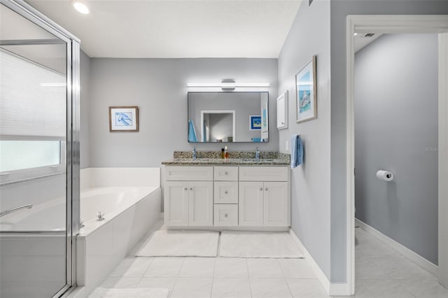 bathroom with tile patterned flooring, vanity, and plus walk in shower