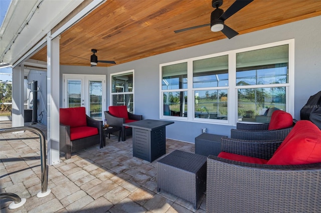 view of patio / terrace with an outdoor living space and ceiling fan