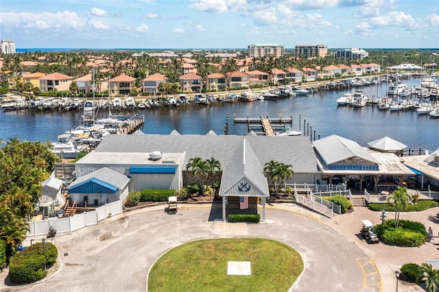 birds eye view of property featuring a water view and a residential view