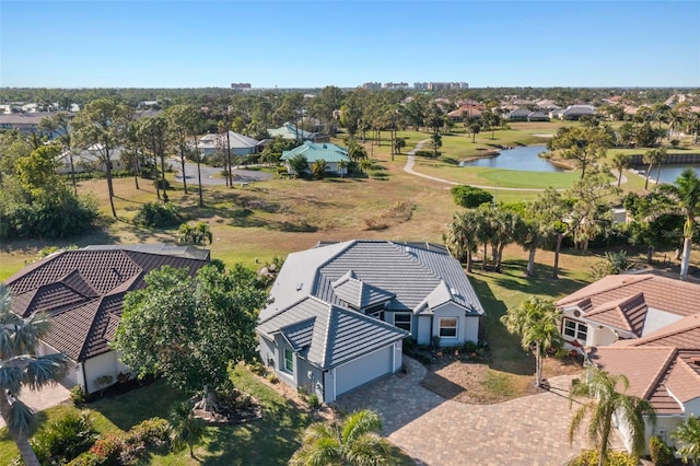 drone / aerial view with a water view and a residential view