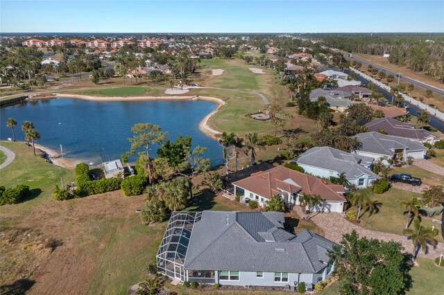 bird's eye view featuring golf course view, a water view, and a residential view