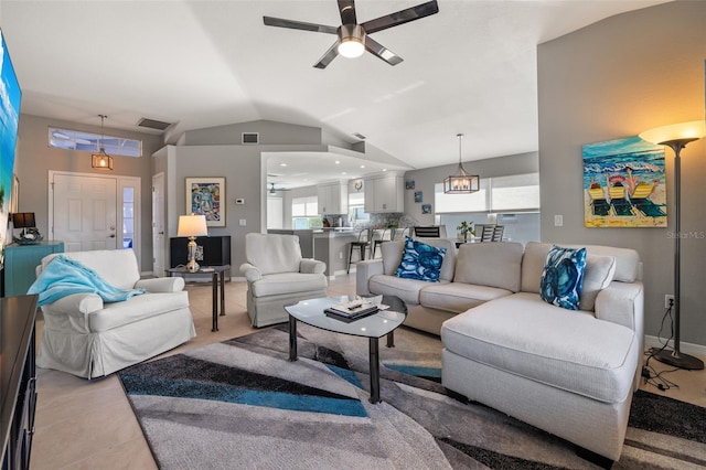 living room featuring visible vents, baseboards, vaulted ceiling, and a ceiling fan