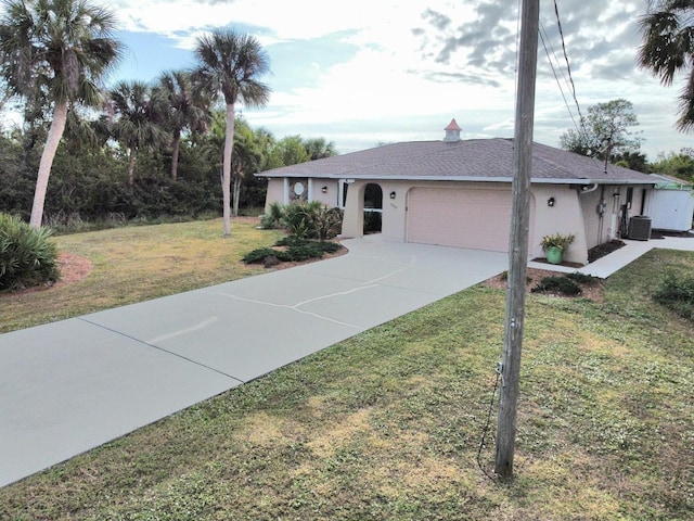 ranch-style house featuring central AC unit, a front yard, and a garage