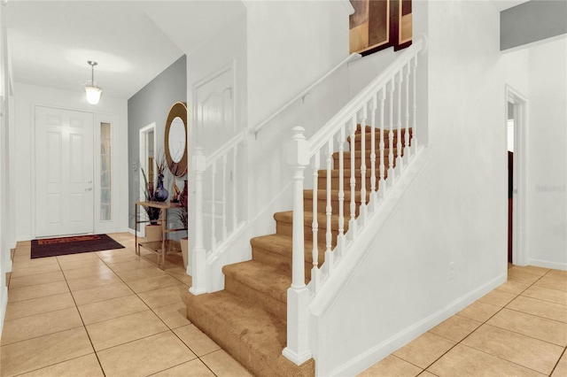 foyer entrance featuring light tile patterned flooring