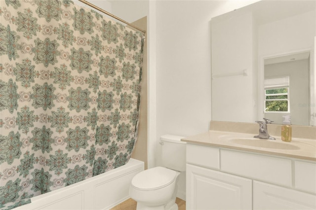 full bathroom with vanity, toilet, and shower / tub combo with curtain