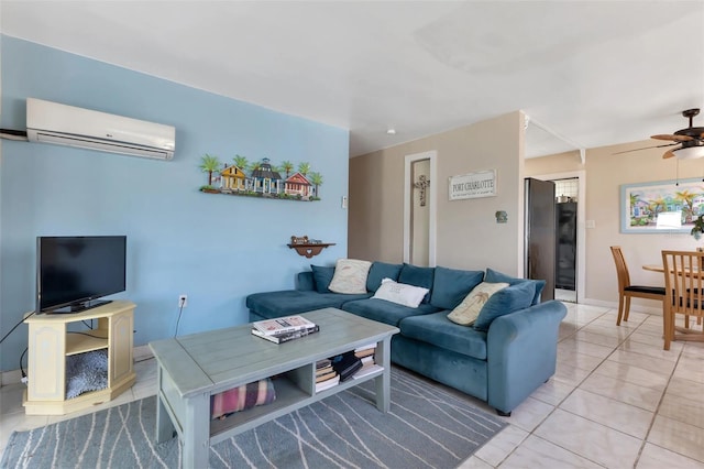 living room featuring light tile patterned floors, a wall unit AC, and ceiling fan