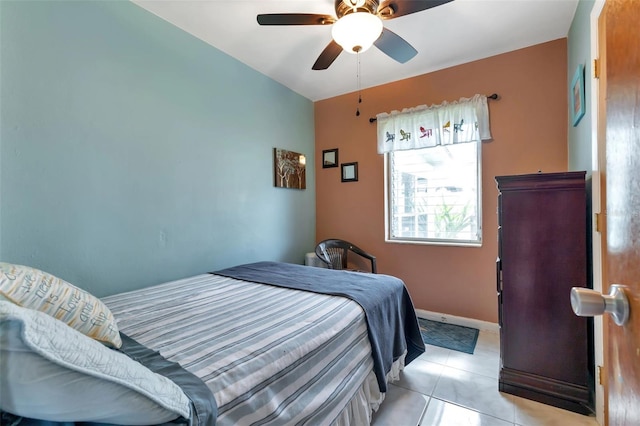 bedroom featuring ceiling fan and light tile patterned floors