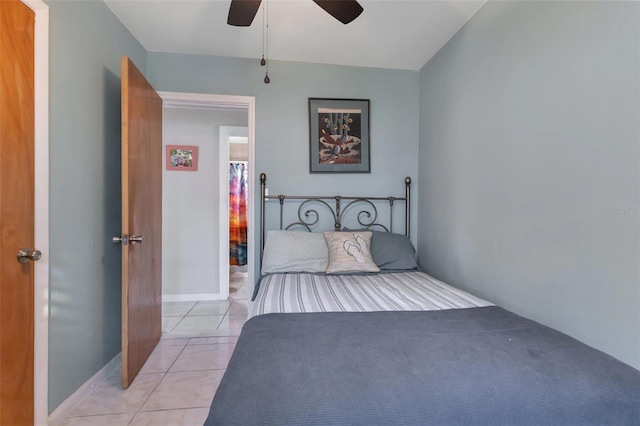 tiled bedroom with ceiling fan