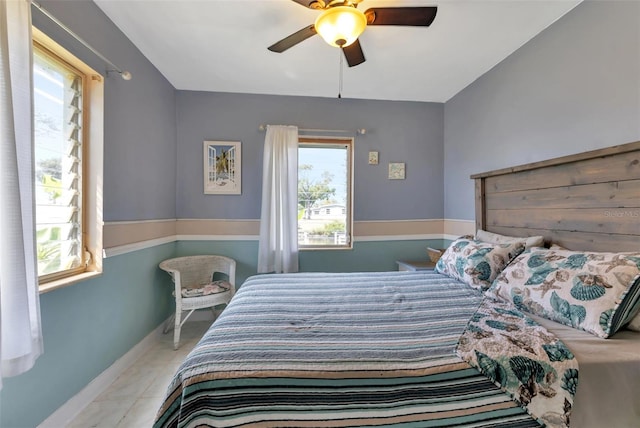 bedroom featuring light tile patterned flooring and ceiling fan