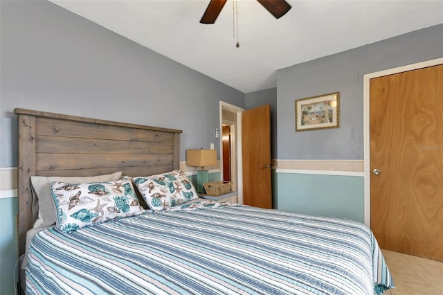 bedroom featuring ceiling fan and a closet