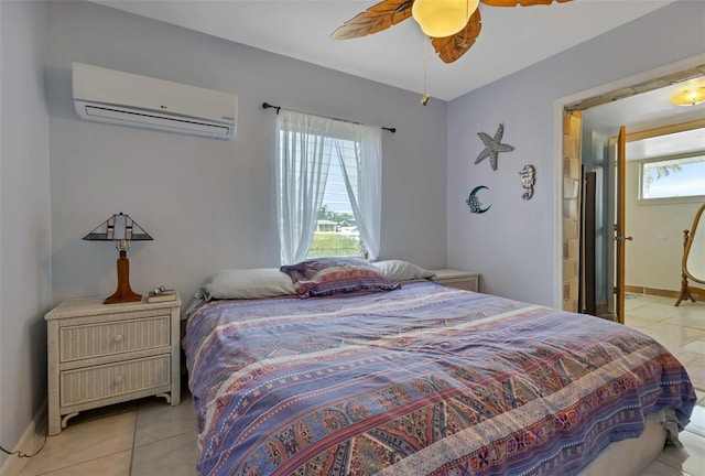 bedroom with a wall mounted AC, ceiling fan, and light tile patterned floors