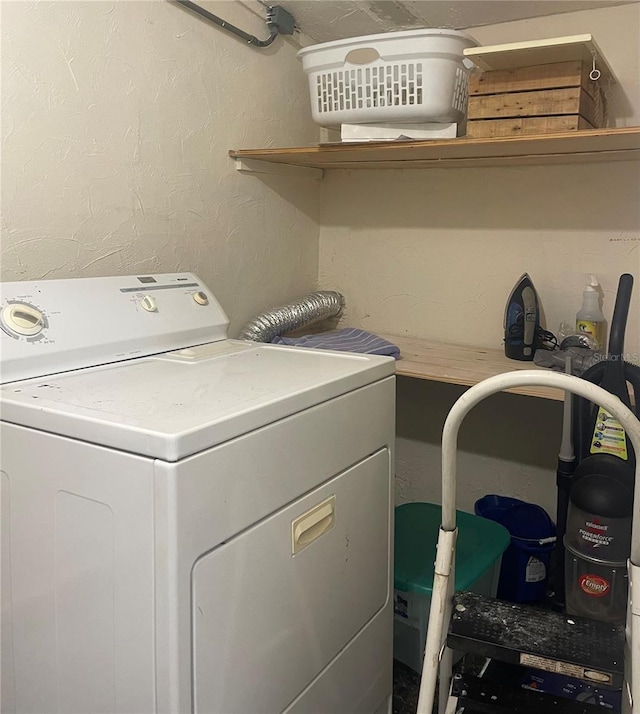 clothes washing area with washer / clothes dryer