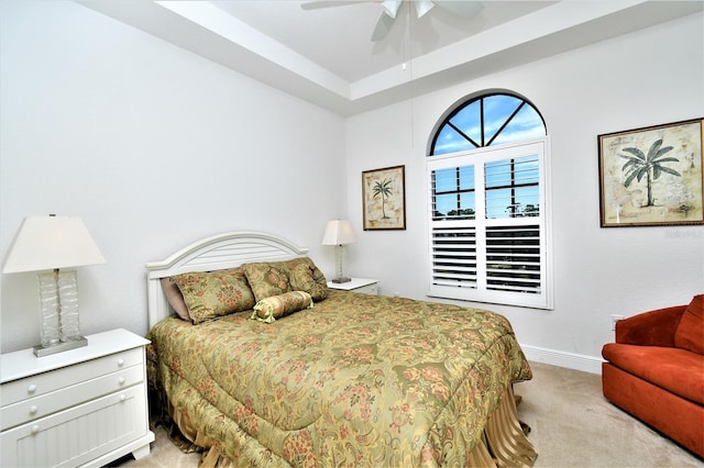 bedroom with ceiling fan and light carpet