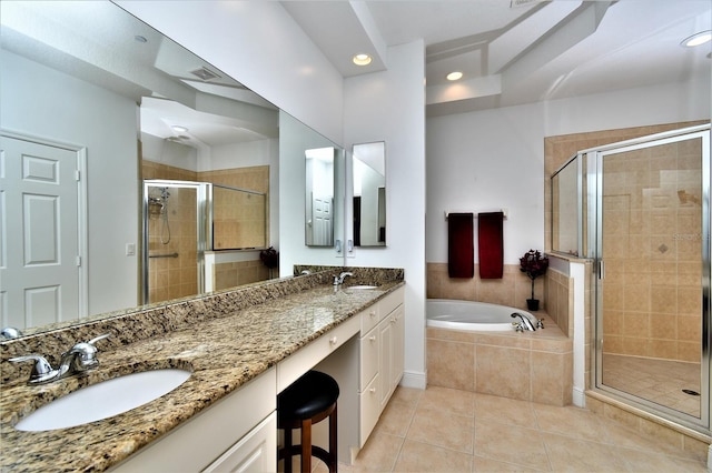 bathroom featuring tile patterned flooring, vanity, and separate shower and tub