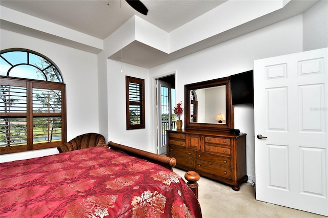 bedroom with light carpet and ceiling fan