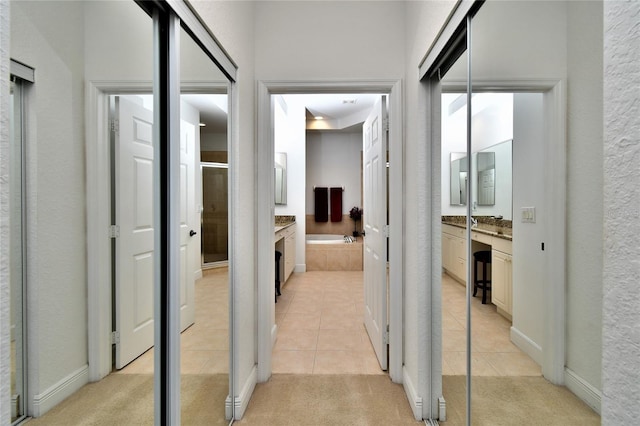 hallway with light tile patterned floors