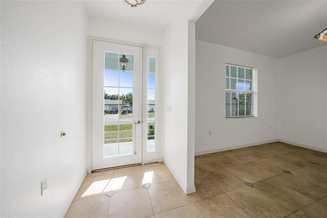 entryway featuring light tile patterned flooring