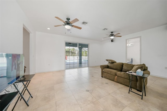 living room with light tile patterned floors and ceiling fan