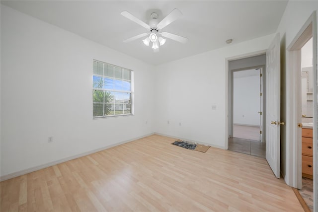 unfurnished bedroom with ceiling fan and light hardwood / wood-style floors