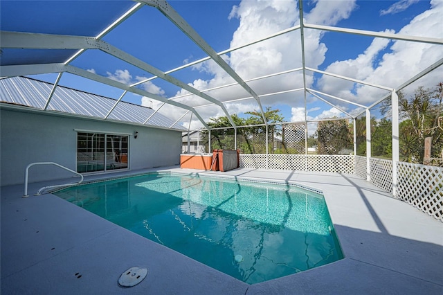 view of pool featuring a patio and glass enclosure