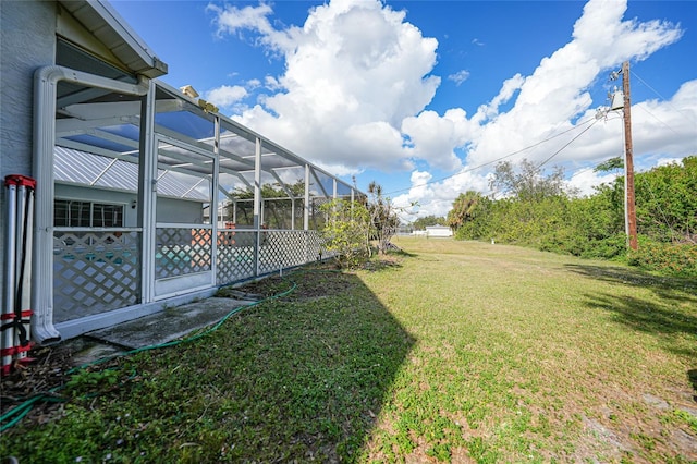 view of yard with a lanai