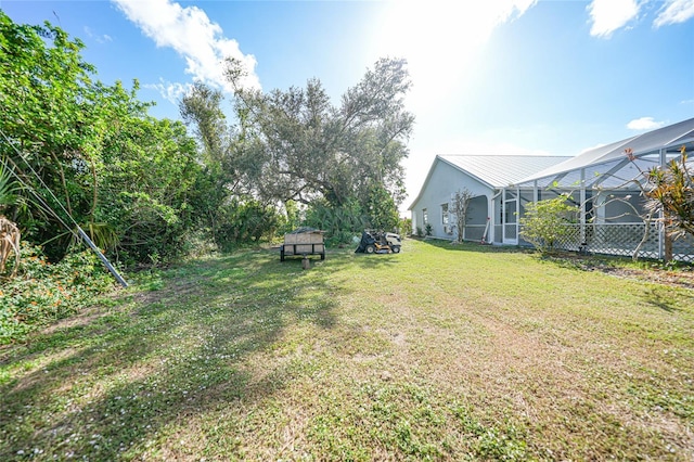 view of yard featuring a lanai