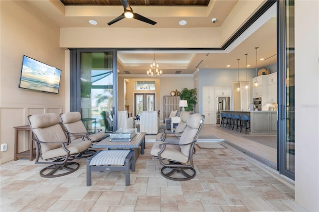 view of patio with ceiling fan and a bar