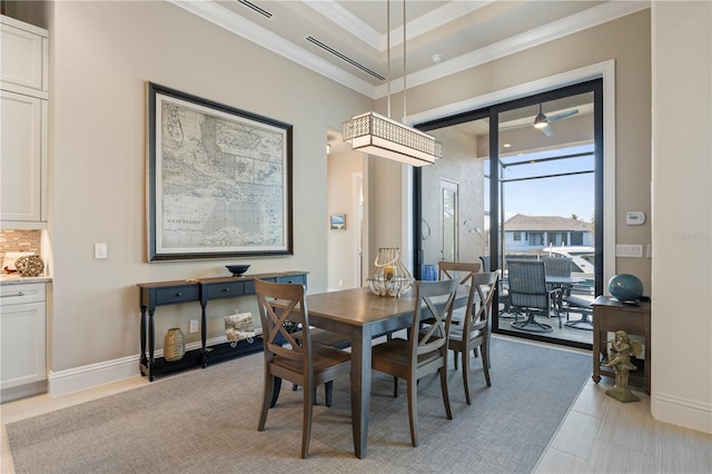 dining space featuring ornamental molding