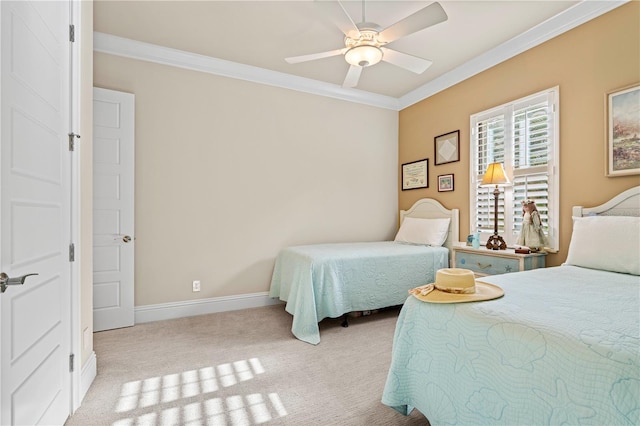 bedroom featuring ceiling fan, crown molding, and light carpet