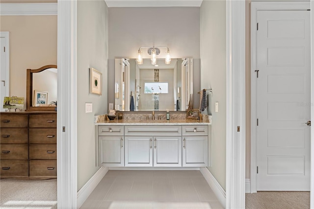 bathroom with vanity and ornamental molding