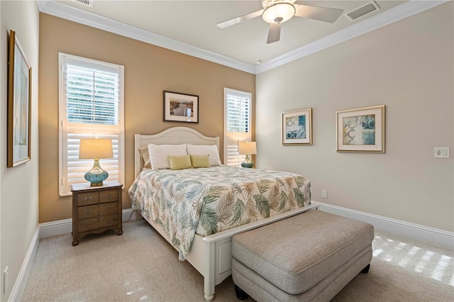 bedroom with multiple windows, ceiling fan, and light colored carpet