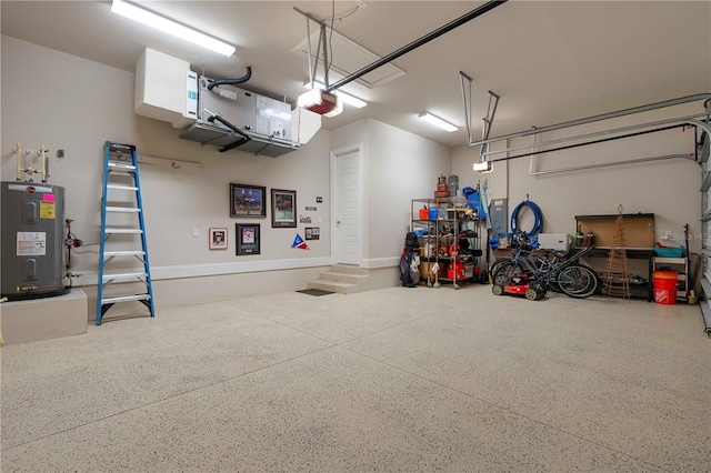 garage with electric water heater and a garage door opener