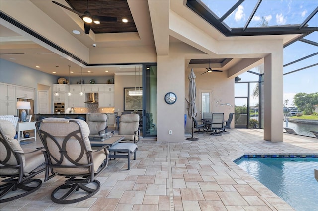 view of pool with ceiling fan and a patio area