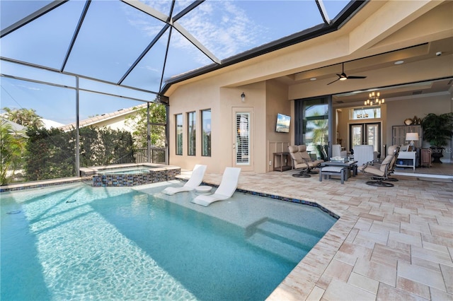 view of pool with an in ground hot tub, a patio area, ceiling fan, and a lanai